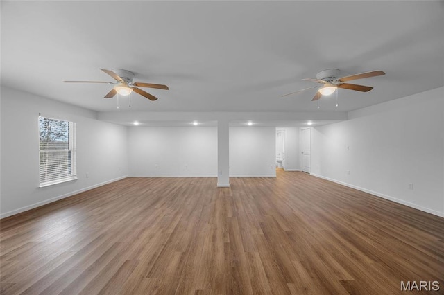 1542 Hickory Lndg, De Soto, MO 63020 - unfurnished living room with a ceiling fan, baseboards, wood finished floors, and recessed lighting