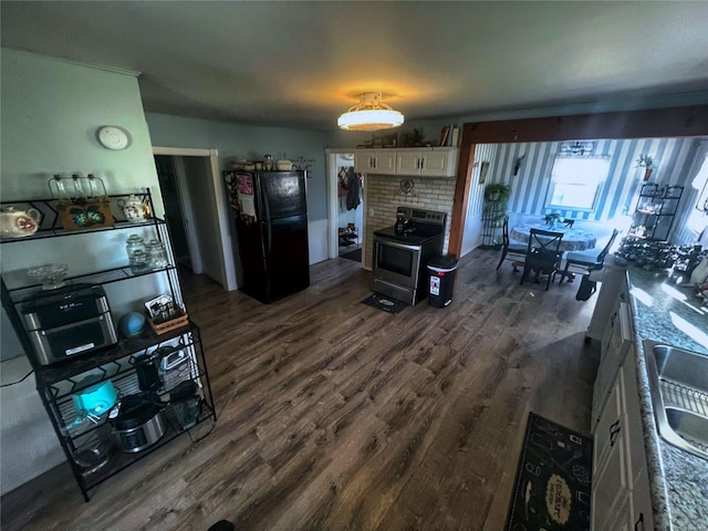 106 S 3rd, Novelty, MO 63460 - living area with dark wood-style floors