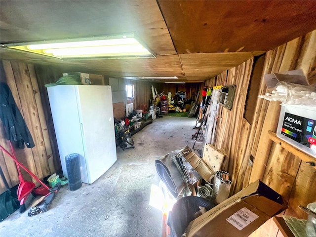 106 S 3rd, Novelty, MO 63460 - garage with freestanding refrigerator and wood walls