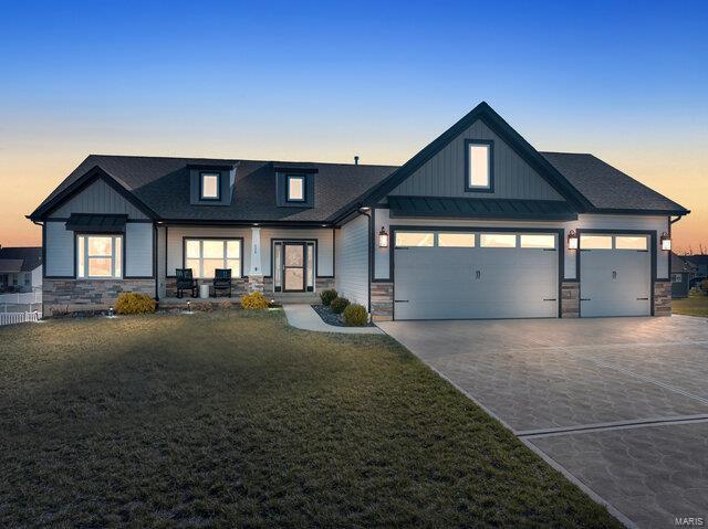 620 Lubbuck Ct, Moscow Mills, MO 63362 - view of front facade featuring stone siding and board and batten siding