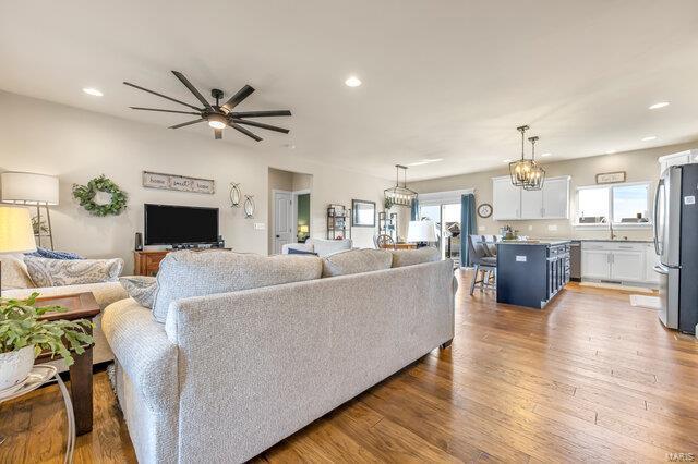 620 Lubbuck Ct, Moscow Mills, MO 63362 - living room with recessed lighting, light wood-type flooring, and a ceiling fan