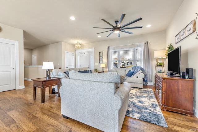 620 Lubbuck Ct, Moscow Mills, MO 63362 - living area with a ceiling fan, wood finished floors, recessed lighting, and baseboards