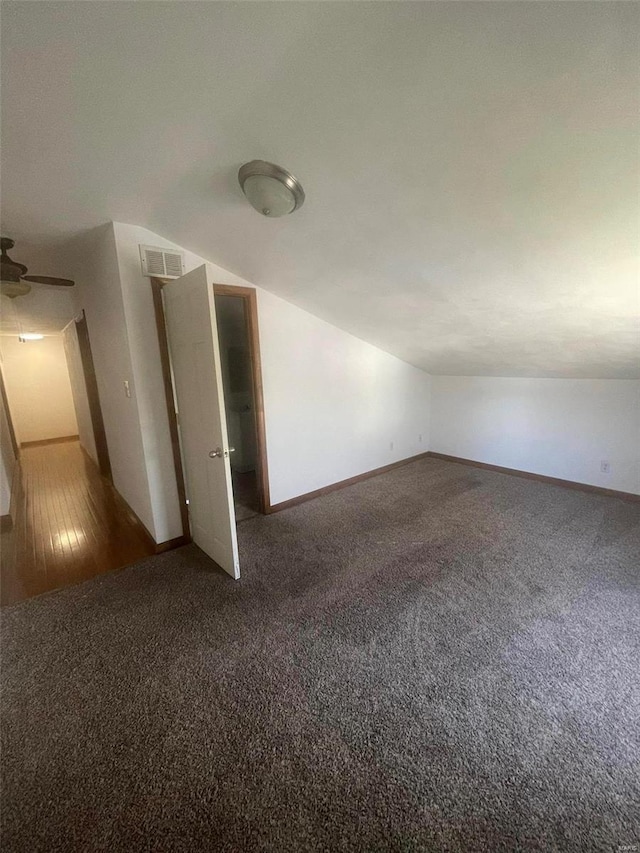 bonus room featuring carpet, vaulted ceiling, baseboards, and ceiling fan