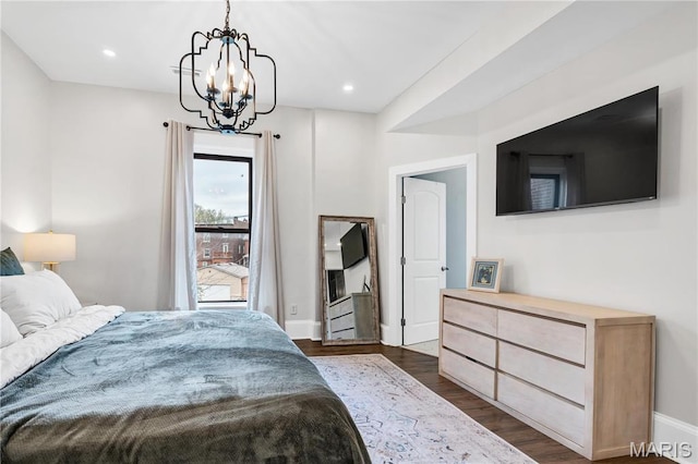 4716 Olive St, Saint Louis, MO 63108 - bedroom with a chandelier, dark wood-style flooring, baseboards, and recessed lighting