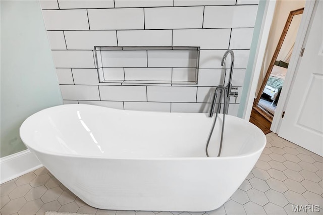 4716 Olive St, Saint Louis, MO 63108 - bathroom view of a freestanding bath and tile walls