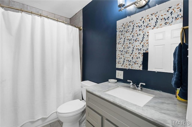 4716 Olive St, Saint Louis, MO 63108 - full bathroom featuring toilet, a shower with shower curtain, vanity, and tile patterned flooring