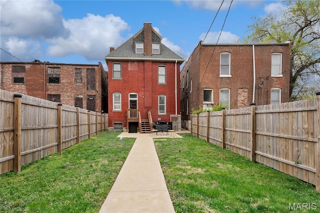 4716 Olive St, Saint Louis, MO 63108 - back of house featuring brick siding