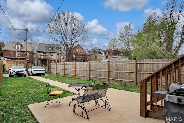 4716 Olive St, Saint Louis, MO 63108 - view of patio featuring a residential view and a grill