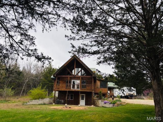 19125 County Road 1220, St James, MO 65559 - back of house with a lawn and a deck