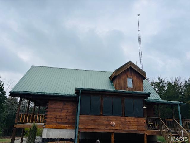 19125 County Road 1220, St James, MO 65559 - view of front of property with metal roof, log exterior, and a porch