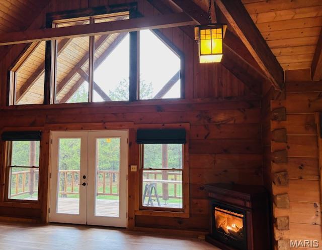 19125 County Road 1220, St James, MO 65559 - entryway featuring wood walls, french doors, wooden ceiling, a fireplace, and light wood-style floors