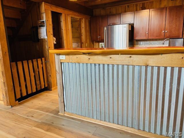 19125 County Road 1220, St James, MO 65559 - kitchen featuring freestanding refrigerator and light wood-style floors