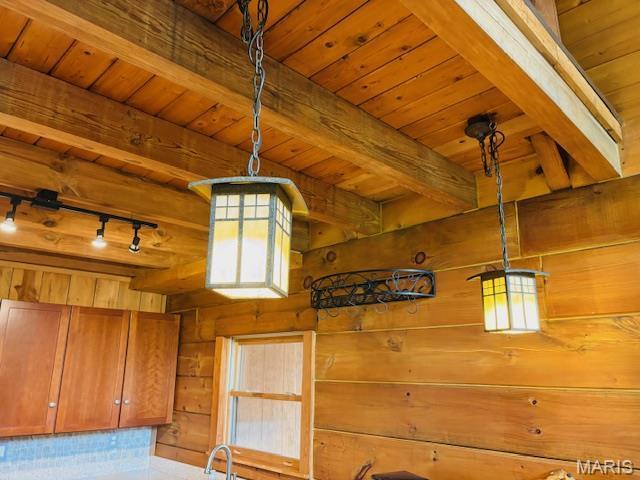 19125 County Road 1220, St James, MO 65559 - detailed view of wooden ceiling, beamed ceiling, wooden walls, rail lighting, and brown cabinets
