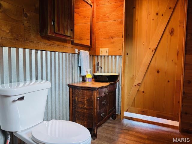 19125 County Road 1220, St James, MO 65559 - half bath with wood finished floors, toilet, and vanity