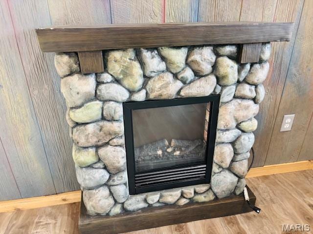 19125 County Road 1220, St James, MO 65559 - detailed view of a fireplace, wood finished floors, wood walls, and baseboards