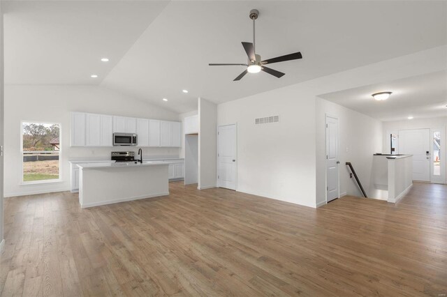 342 Cumberland Ct, Truesdale, MO 63380 - unfurnished living room with vaulted ceiling, light wood-style flooring, ceiling fan, and recessed lighting