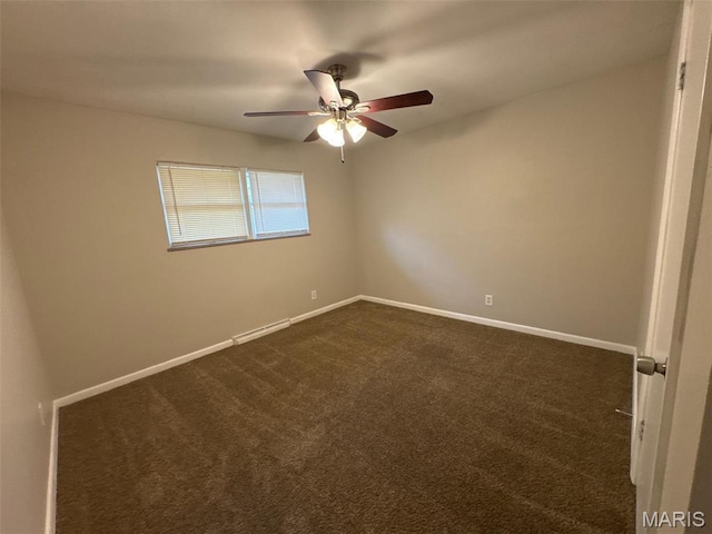 2355 Redman Rd, Saint Louis, MO 63136 - unfurnished room with a ceiling fan, dark colored carpet, and baseboards