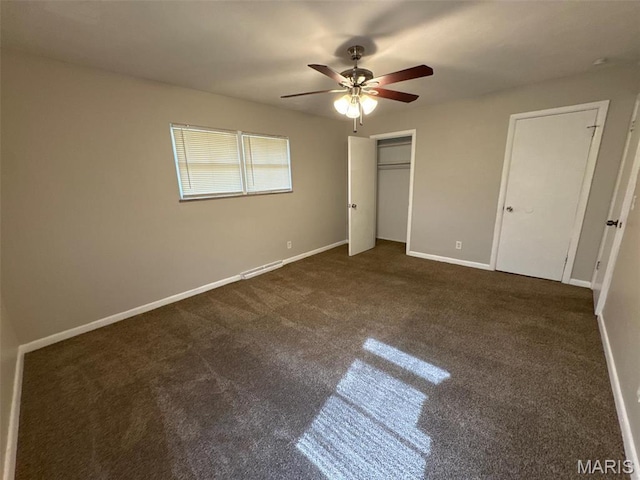 2355 Redman Rd, Saint Louis, MO 63136 - unfurnished bedroom featuring dark colored carpet, baseboards, and a ceiling fan