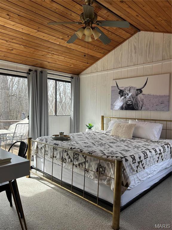 628 W St Gallen Dr, Innsbrook, MO 63390 - carpeted bedroom with wooden ceiling, vaulted ceiling, and wood walls
