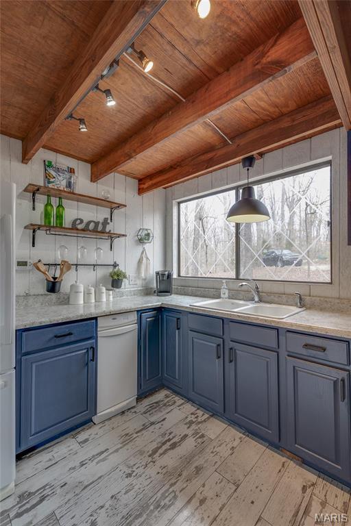 628 W St Gallen Dr, Innsbrook, MO 63390 - kitchen with a sink, wood ceiling, blue cabinets, beam ceiling, and light wood-style floors
