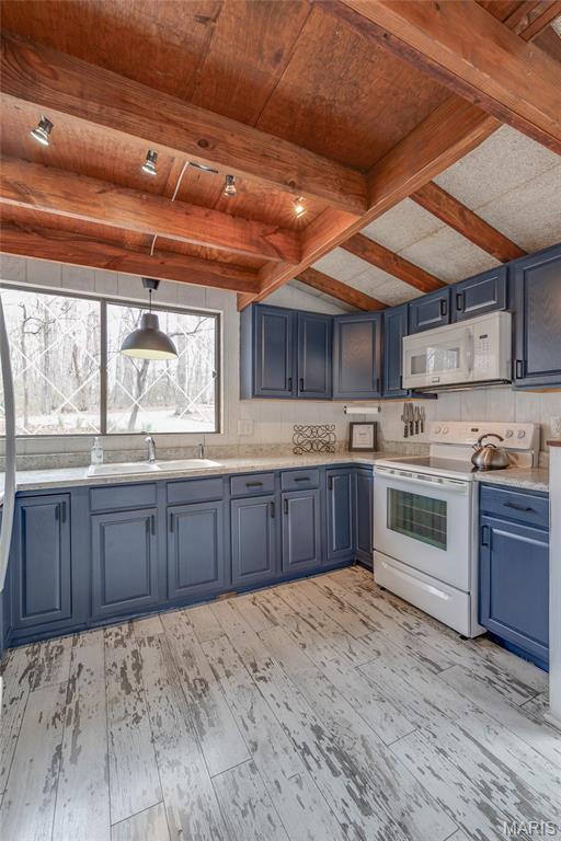 628 W St Gallen Dr, Innsbrook, MO 63390 - kitchen with white appliances, a sink, blue cabinetry, light wood-style floors, and beamed ceiling