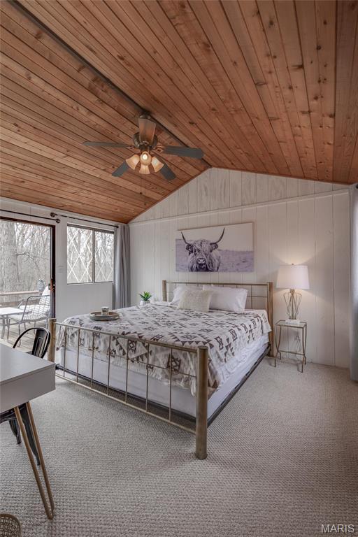 628 W St Gallen Dr, Innsbrook, MO 63390 - carpeted bedroom featuring lofted ceiling, wood ceiling, wood walls, ceiling fan, and access to outside