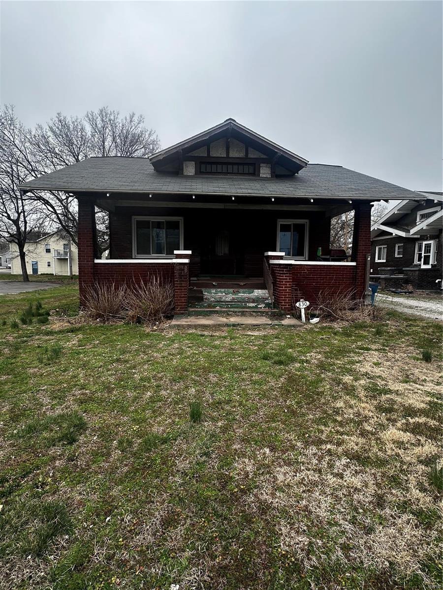 830 N Wood River Ave, Wood River, IL 62095 - back of property featuring a porch and a yard
