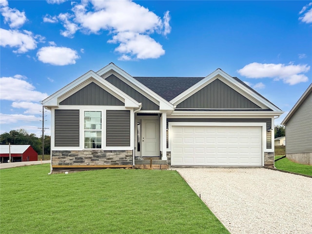 3300 Back Ln Unit 51Stb, Washington, MO 63090 - view of front of home featuring gravel driveway, stone siding, board and batten siding, and a front yard