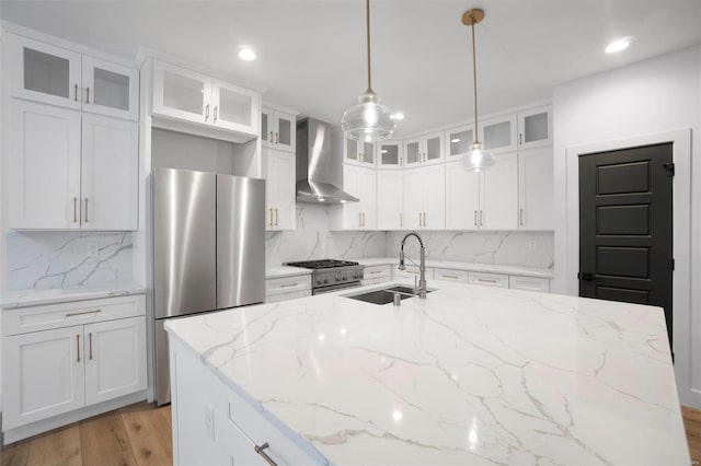 3300 Back Ln Unit 51Stb, Washington, MO 63090 - kitchen with wall chimney exhaust hood, appliances with stainless steel finishes, a sink, backsplash, and recessed lighting
