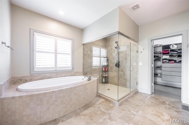 7032 Koufax Ct, Edwardsville, IL 62025 - bathroom with a bath, a stall shower, and a walk in closet