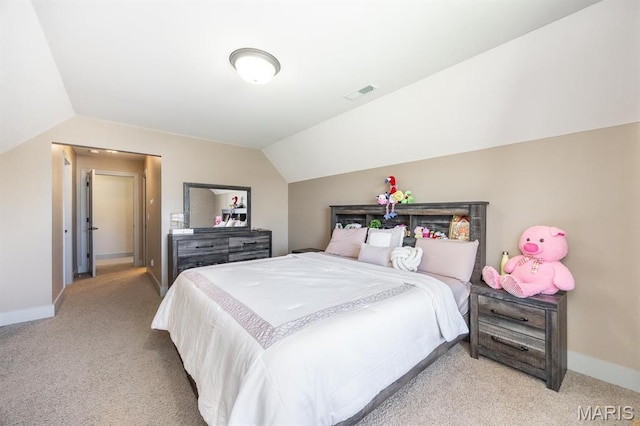 7032 Koufax Ct, Edwardsville, IL 62025 - bedroom with light carpet, vaulted ceiling, and baseboards
