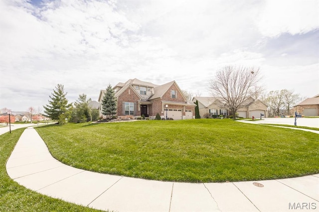 7032 Koufax Ct, Edwardsville, IL 62025 - view of front of property with a residential view, a front yard, a garage, and brick siding
