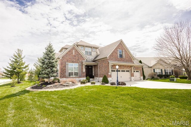 7032 Koufax Ct, Edwardsville, IL 62025 - view of front facade with brick siding, concrete driveway, a front lawn, and a garage