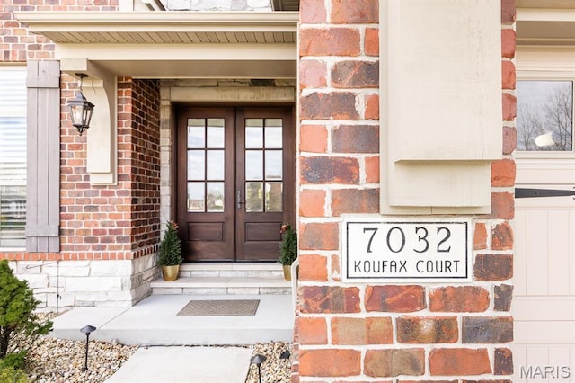 7032 Koufax Ct, Edwardsville, IL 62025 - doorway to property featuring french doors and brick siding