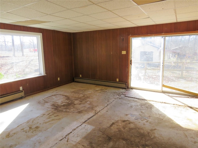 8 Indian Hills Dr, Cuba, MO 65453 - spare room with a baseboard radiator, a paneled ceiling, and wooden walls