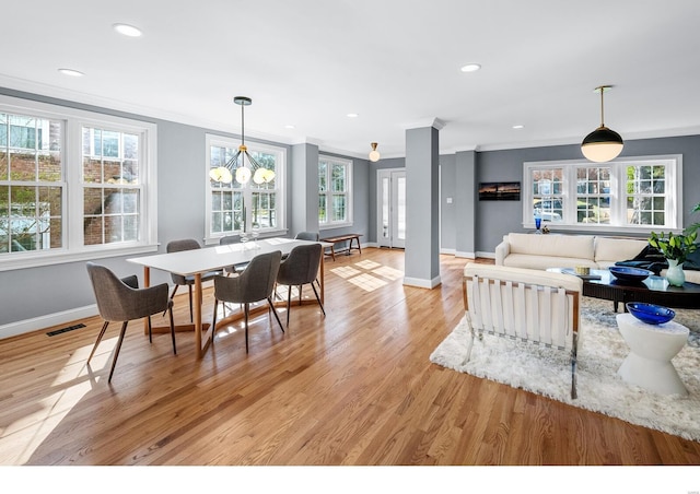 7825 Lafon Pl, Saint Louis, MO 63130 - dining space featuring ornamental molding, baseboards, plenty of natural light, light wood-style flooring, and recessed lighting