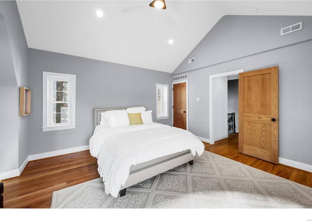 7825 Lafon Pl, Saint Louis, MO 63130 - bedroom with wood finished floors, baseboards, high vaulted ceiling, a ceiling fan, and recessed lighting