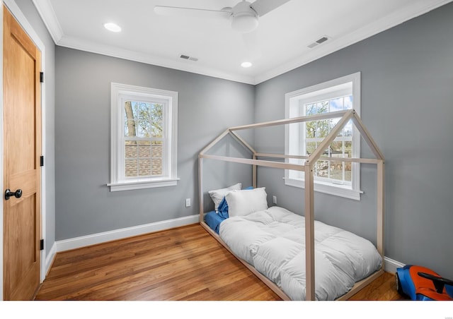 7825 Lafon Pl, Saint Louis, MO 63130 - bedroom featuring crown molding, wood finished floors, recessed lighting, baseboards, and ceiling fan