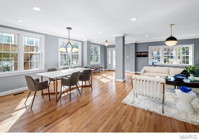 7825 Lafon Pl, Saint Louis, MO 63130 - dining space featuring ornamental molding, baseboards, light wood-style floors, recessed lighting, and a chandelier
