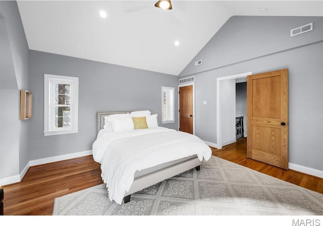 7825 Lafon Pl, Saint Louis, MO 63130 - bedroom featuring wood finished floors, baseboards, recessed lighting, and high vaulted ceiling