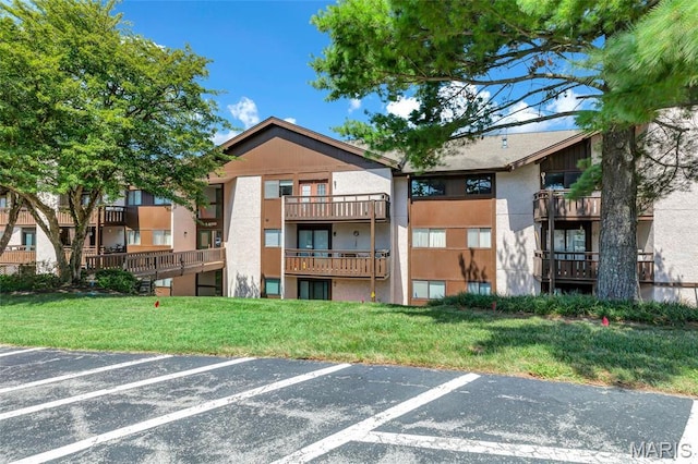1400 Heritage Gdn # 305, Saint Charles, MO 63303 - view of building exterior with uncovered parking
