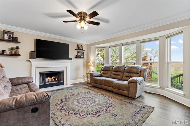 6833 Brandywine Ct, Fairview Heights, IL 62208 - living room featuring ornamental molding, a ceiling fan, a fireplace with flush hearth, plenty of natural light, and baseboards