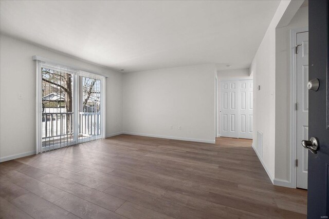 7600 Triwoods Dr Unit G, Saint Louis, MO 63119 - spare room featuring wood finished floors and baseboards