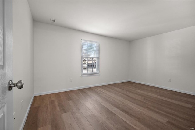 7600 Triwoods Dr Unit G, Saint Louis, MO 63119 - spare room featuring wood finished floors and baseboards