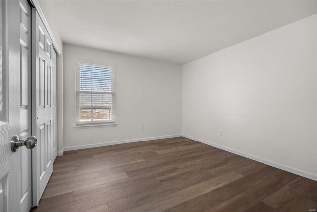 7600 Triwoods Dr Unit G, Saint Louis, MO 63119 - unfurnished bedroom featuring wood finished floors and baseboards