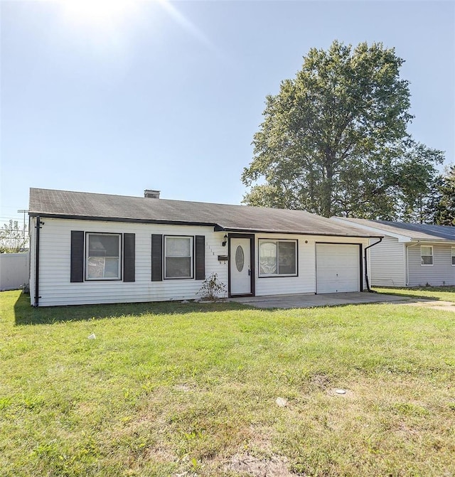 ranch-style house with a garage, a front lawn, and asphalt driveway