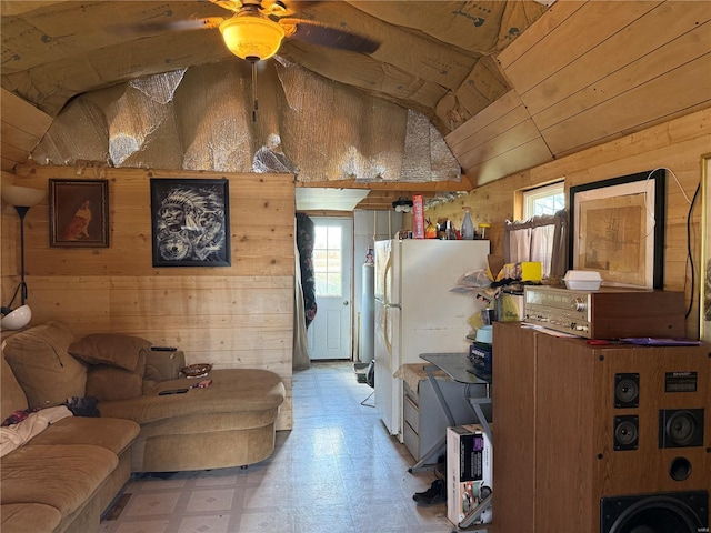 219 S W St, Brownstown, IL 62418 - living room featuring wood walls, lofted ceiling, light flooring, and ceiling fan