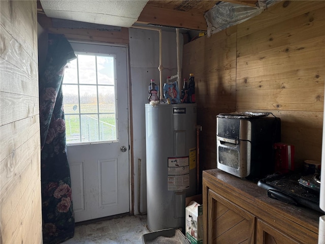 219 S W St, Brownstown, IL 62418 - doorway to outside featuring water heater and healthy amount of natural light