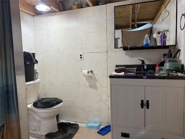 219 S W St, Brownstown, IL 62418 - half bath featuring toilet, vanity, tile patterned flooring, and tile walls