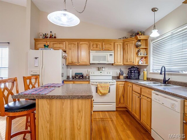 105 Megan Ct, Valmeyer, IL 62295 - kitchen with white appliances, lofted ceiling, a sink, light wood finished floors, and a center island